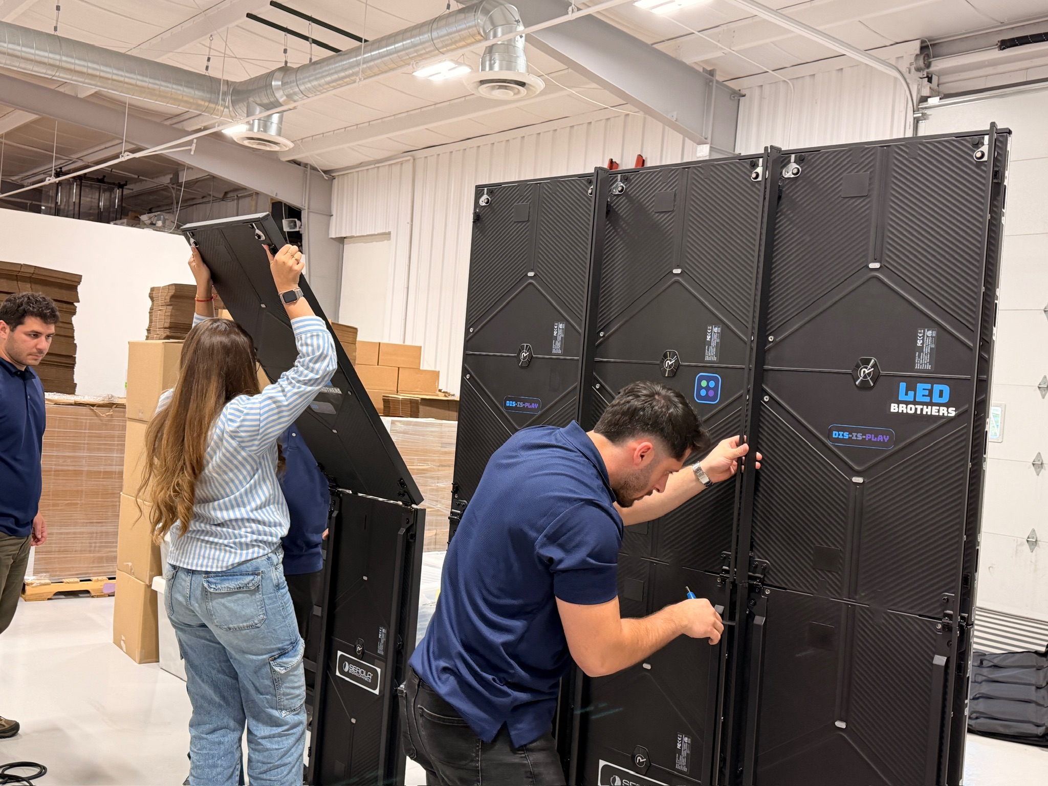 Team assembling an LED wall